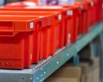 Modern High Rack Warehouse with Automated Order Handling as an Online Retail Center Modern High Rack Warehouse with a lot of high rise storage places and automated order processing